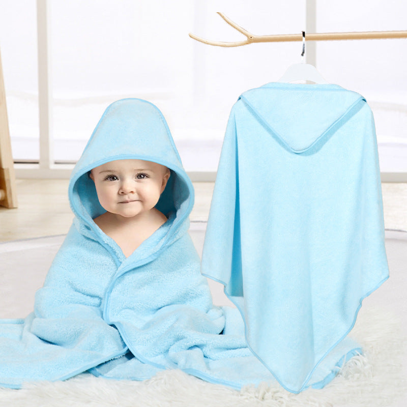 Baby cuddled in coral fleece cape
