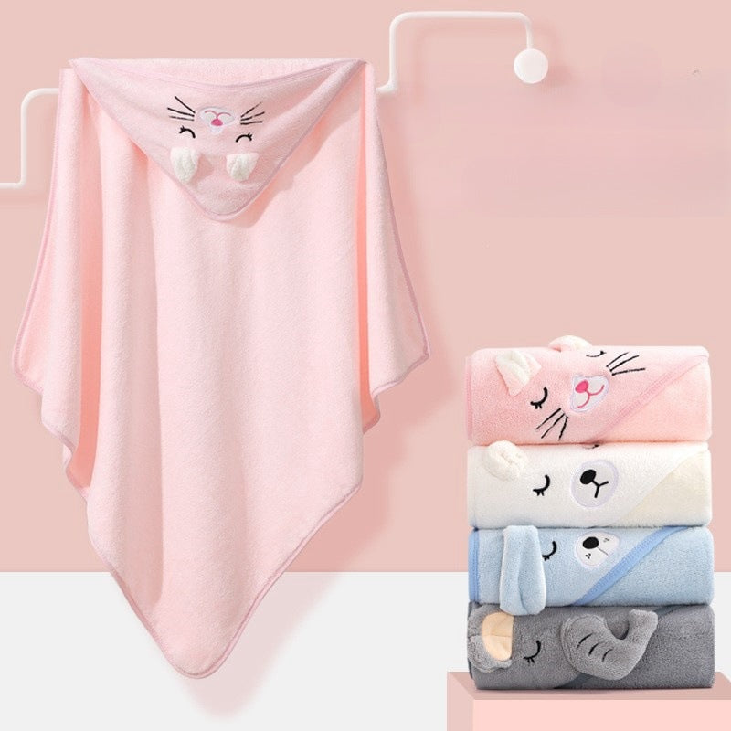 Baby cuddled in coral fleece cape