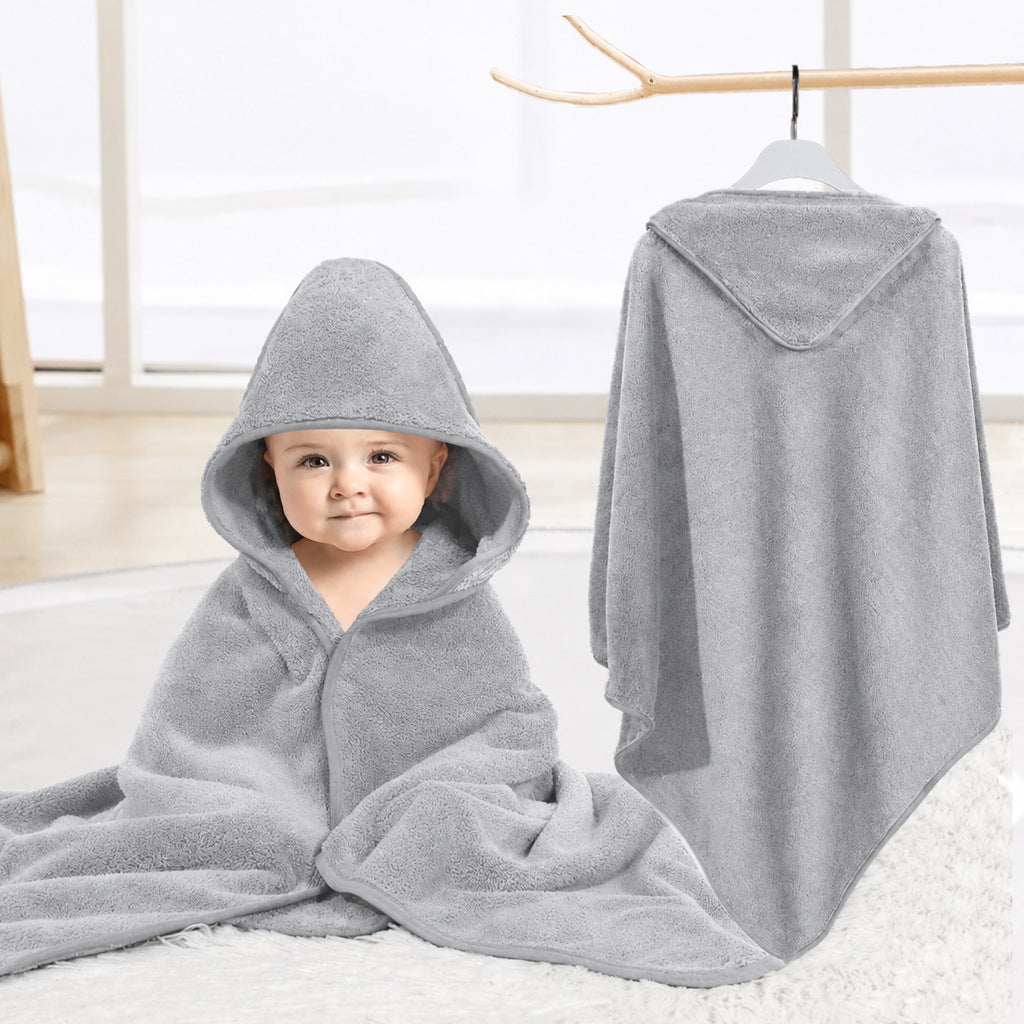 Baby cuddled in coral fleece cape