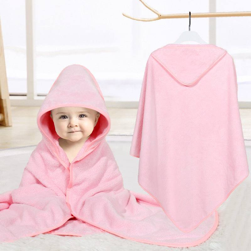 Baby cuddled in coral fleece cape